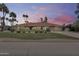 Charming home with a well-maintained lawn and vibrant landscaping, showcasing curb appeal at 8907 N 85Th Way, Scottsdale, AZ 85258
