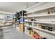 Garage space featuring multiple shelves and ample room for storage and organization at 8907 N 85Th Way, Scottsdale, AZ 85258
