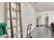 This garage shows organized storage, ladders, and a clean, painted floor and walls at 8907 N 85Th Way, Scottsdale, AZ 85258