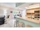 Open kitchen featuring a breakfast bar with seating, tiled floors, and views of the dining area at 8907 N 85Th Way, Scottsdale, AZ 85258