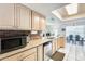 Kitchen showcasing stainless steel appliances, wooden cabinets, and tile flooring at 8907 N 85Th Way, Scottsdale, AZ 85258