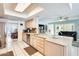 Spacious kitchen with modern appliances, cabinetry, and a breakfast bar that opens to the living area at 8907 N 85Th Way, Scottsdale, AZ 85258
