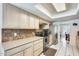 Kitchen showcasing wooden cabinets, tile backsplash, and stainless steel appliances at 8907 N 85Th Way, Scottsdale, AZ 85258