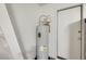 Utility area showcasing a modern water heater unit, essential for home maintenance and functionality at 8907 N 85Th Way, Scottsdale, AZ 85258