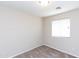 Bedroom featuring carpeted floors, neutral paint, and a window at 9319 W Crown King Rd, Tolleson, AZ 85353