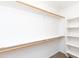 Spacious walk-in closet with built-in shelving for storage at 9319 W Crown King Rd, Tolleson, AZ 85353