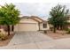 Charming single-story home with a two-car garage, desert landscaping, and neutral paint at 9319 W Crown King Rd, Tolleson, AZ 85353