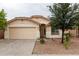 Charming single-story home with a two-car garage and low maintenance desert landscaping at 9319 W Crown King Rd, Tolleson, AZ 85353