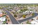 Overview of the homes in a neatly organized residential area, adjacent to lush green golf course at 9621 E Calgary Ave, Sun Lakes, AZ 85248