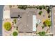 Aerial view of a home's roof, landscape, and nearby street at 9621 E Calgary Ave, Sun Lakes, AZ 85248