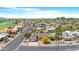 A sprawling residential area with lush green fairways and community pool under a bright blue sky at 9621 E Calgary Ave, Sun Lakes, AZ 85248