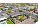 Home with desert landscape, including cactus and flowering bushes and a covered patio at 9621 E Calgary Ave, Sun Lakes, AZ 85248