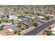 Aerial view of a residential neighborhood with well-maintained homes and mature landscaping at 9621 E Calgary Ave, Sun Lakes, AZ 85248