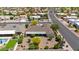 Aerial image showing a home's landscaped yard with mature trees and desert landscaping at 9621 E Calgary Ave, Sun Lakes, AZ 85248
