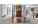 Elegant foyer showcasing a wooden front door, a stylish rug, and neutral decor at 9621 E Calgary Ave, Sun Lakes, AZ 85248