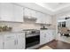 Bright kitchen featuring granite countertops, stainless steel appliances and bright white cabinets at 9621 E Calgary Ave, Sun Lakes, AZ 85248