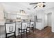 Bright kitchen featuring granite countertops, stainless steel appliances and bright white cabinets at 9621 E Calgary Ave, Sun Lakes, AZ 85248