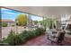 Cozy covered patio with tiled floor and view of landscaped backyard at 9621 E Calgary Ave, Sun Lakes, AZ 85248