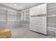 Spacious walk-in closet featuring built-in shelving and ample storage space at 9621 E Calgary Ave, Sun Lakes, AZ 85248