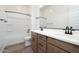 Modern bathroom featuring a double sink vanity, soaking tub with shower, and tile flooring at 10022 S 37Th Ave, Laveen, AZ 85339