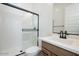Bathroom with glass shower enclosure and single sink vanity at 10022 S 37Th Ave, Laveen, AZ 85339