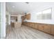 Open layout featuring a modern kitchen with lots of wood cabinets and stainless appliances at 10022 S 37Th Ave, Laveen, AZ 85339