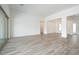 Bright, open living room with tile floors and large sliding glass doors that offer natural light at 10022 S 37Th Ave, Laveen, AZ 85339
