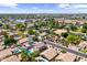 Neighborhood aerial view showcasing inviting homes, swimming pools, and lush greenery in a vibrant community at 108 E Horseshoe Ave, Gilbert, AZ 85296