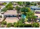 Charming single-story home featuring a private backyard with a sparkling pool and lush landscaping at 108 E Horseshoe Ave, Gilbert, AZ 85296