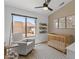 Bright Bedroom with hardwood floors, neutral tones, wooden crib and chair at 108 E Horseshoe Ave, Gilbert, AZ 85296
