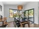 Inviting dining room with table, chairs, pendant lighting, and sliding glass doors to the backyard at 108 E Horseshoe Ave, Gilbert, AZ 85296