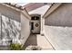 Inviting home entrance featuring a decorative wreath, textured walls, and a covered walkway at 108 E Horseshoe Ave, Gilbert, AZ 85296