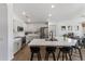 Bright, modern kitchen featuring white cabinets, stainless steel appliances, and a large island with bar seating at 108 E Horseshoe Ave, Gilbert, AZ 85296