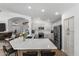 Spacious kitchen features white cabinets, stainless steel appliances, a large island with bar seating, and open layout at 108 E Horseshoe Ave, Gilbert, AZ 85296