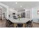 Bright kitchen featuring a large center island with bar seating and stainless steel appliances at 108 E Horseshoe Ave, Gilbert, AZ 85296