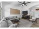Cozy living room with a modern fireplace, large windows, and comfortable seating arrangement at 108 E Horseshoe Ave, Gilbert, AZ 85296