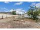 Backyard features a pool, chain link fence, sparse landscaping, mountain views, and a single-story white home at 13039 N 19Th Ave, Phoenix, AZ 85029