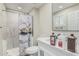 Cozy bathroom with a shower, white vanity, toilet, and decorative shower curtain at 13039 N 19Th Ave, Phoenix, AZ 85029