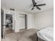 Bedroom with neutral paint, closet with sliding doors, and ceiling fan at 13039 N 19Th Ave, Phoenix, AZ 85029