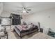 Bedroom with carpet flooring, ceiling fan, and window with dark curtains at 13039 N 19Th Ave, Phoenix, AZ 85029