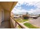 Condo balcony overlooking parking with lush landscape and neighborhood at 1333 E Morten Ave # 230, Phoenix, AZ 85020