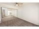 Bright bedroom with a ceiling fan and carpeted floors, featuring a large mirrored closet at 1333 E Morten Ave # 230, Phoenix, AZ 85020