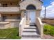 Welcoming front entrance featuring white door, stone steps, and an arched entryway at 1333 E Morten Ave # 230, Phoenix, AZ 85020