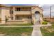 Charming two-story condo featuring stucco siding, a red tile roof and well-maintained front lawn at 1333 E Morten Ave # 230, Phoenix, AZ 85020