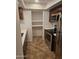 Efficient kitchen layout featuring stainless steel appliances, dark cabinets, and convenient shelving space at 1333 E Morten Ave # 230, Phoenix, AZ 85020
