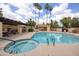 Beautiful community pool and spa with lounge chairs and a covered patio at 1333 E Morten Ave # 230, Phoenix, AZ 85020
