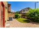 Well-kept backyard with brick-paved patio, lush greenery, and ample space for outdoor activities and relaxation at 1350 S Greenfield Rd # 1125, Mesa, AZ 85206
