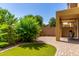 Charming backyard featuring lush greenery, a well-manicured lawn, and a cozy seating area for outdoor enjoyment at 1350 S Greenfield Rd # 1125, Mesa, AZ 85206