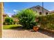 Well-maintained backyard with a brick patio, green shrubbery, potted flowers, and a sense of private outdoor living at 1350 S Greenfield Rd # 1125, Mesa, AZ 85206