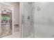 Bathroom featuring a glass enclosed walk in shower and stylish fixtures, along with tile flooring at 1350 S Greenfield Rd # 1125, Mesa, AZ 85206